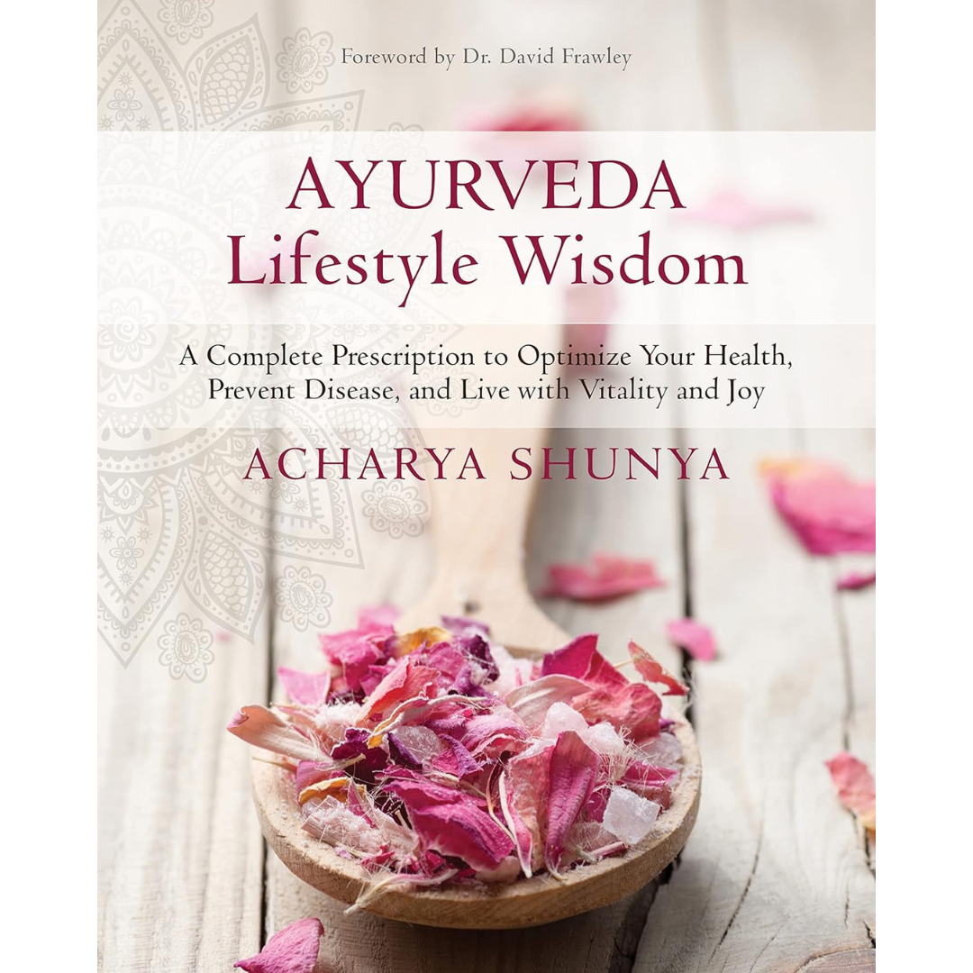 Book cover of 'Ayurveda Lifestyle Wisdom' with a wooden spoon and pink petals on a light background.