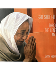 Book cover featuring an elderly woman with hands clasped, titled 'Sri Siddhi Ma Through The Lens Of My Eye' by Jaya Prasada.