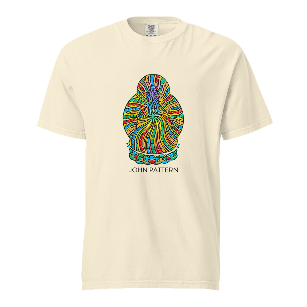 A cream-colored short-sleeve t-shirt with a colorful, intricate spiral graphic in the center and the text 'JOHN PATTERN' printed below it.