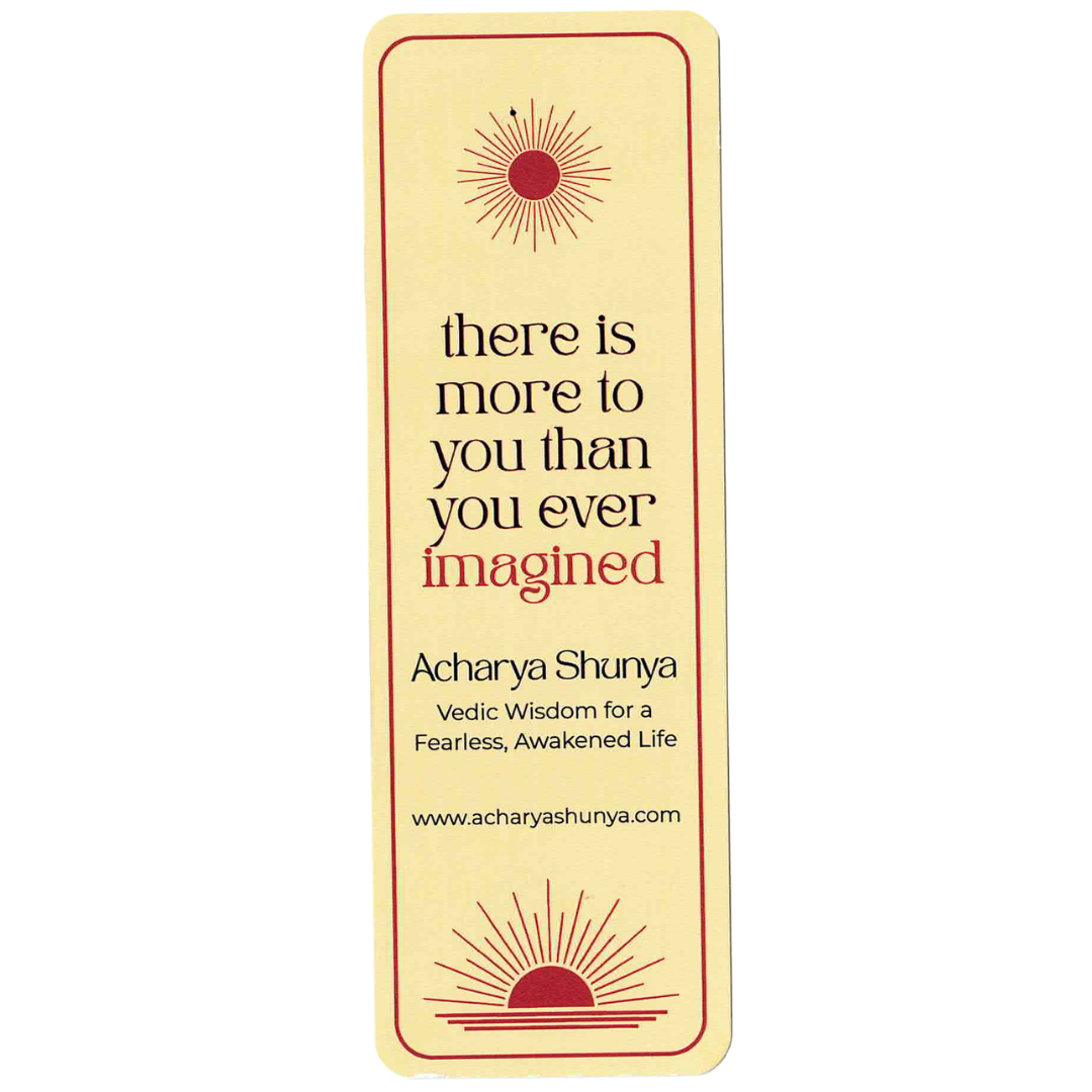A vertical cream-colored book bookmark featuring the quote 'there is more to you than you ever imagined' by Acharya Shunya, with red sunburst illustrations at the top and bottom.